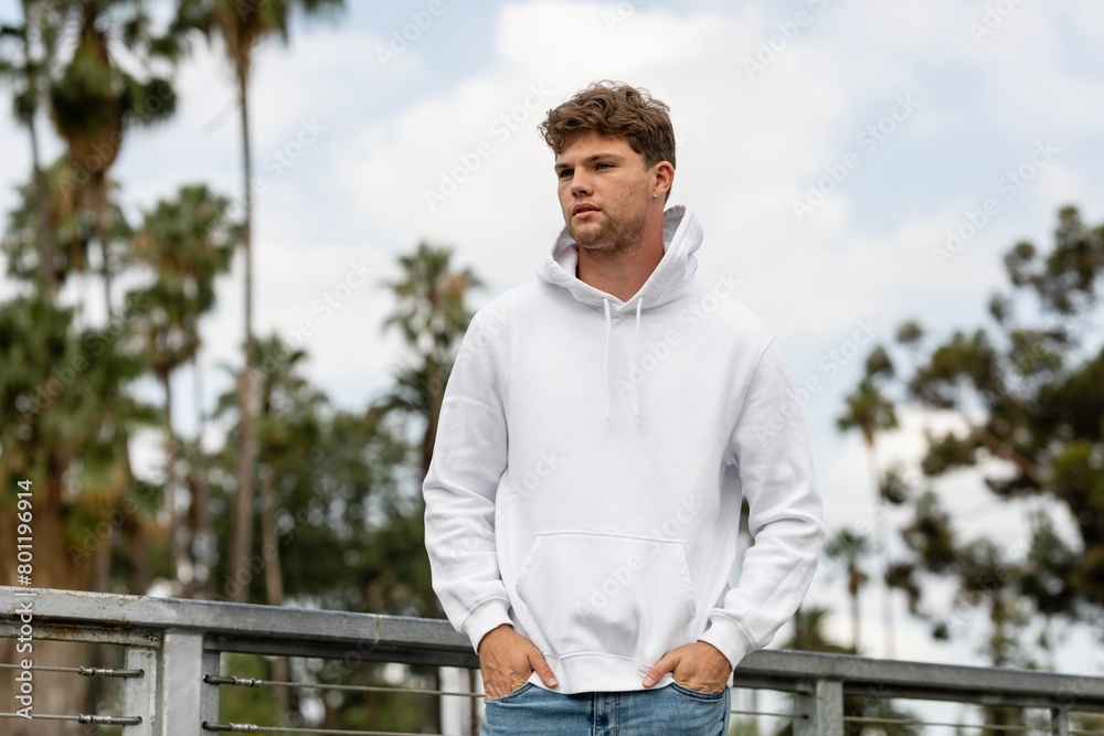 Man in white hoodie, casual wear fashion Man in white hoodie, casual wear fashion