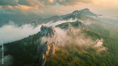 Mountains in clouds at sunrise in summer.Aerial view photo