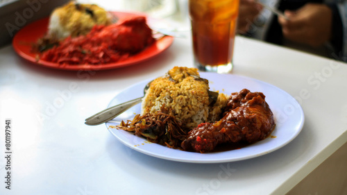 Nasi Kandar with red fried chicken as a side dish