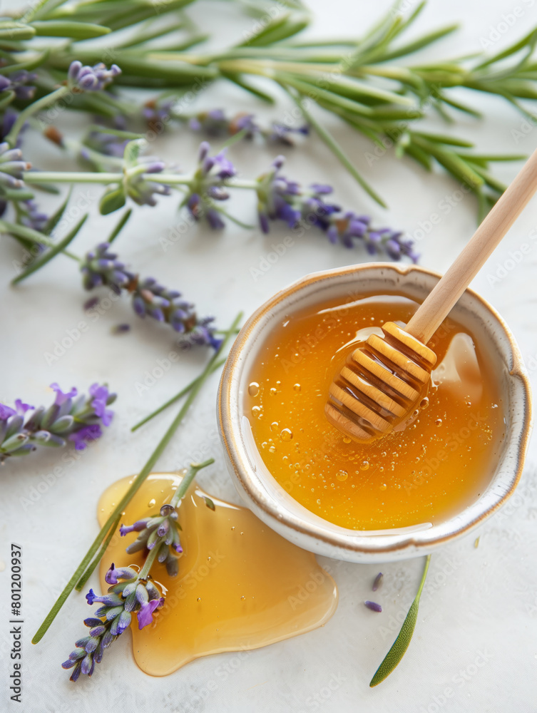 Honey in ceramic bowl with honey dipper lavender flowers on white surface. Aesthetic food concept Honey in ceramic bowl with honey dipper lavender flowers on white surface. Aesthetic food concept