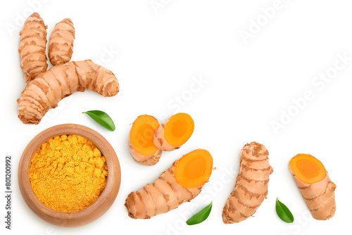 Turmeric powder in wooden bowl and turmeric root isolated on white background. Top view with copy space for your text. Flat lay © kolesnikovserg