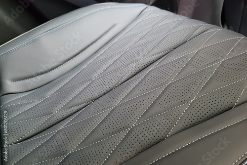 Close up detail premium grey leather seat in a modern car.