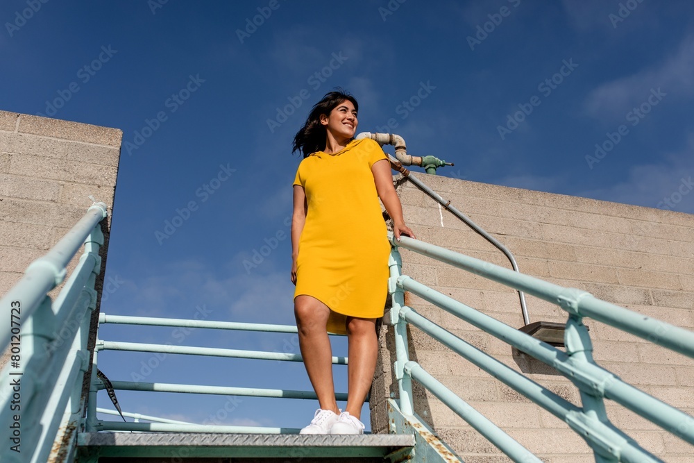 Woman wearing a yellow dress, outdoors summer shoot Woman wearing a yellow dress, outdoors summer shoot