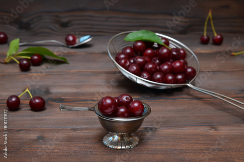 organic fresh ripe cherries on dark wooden background