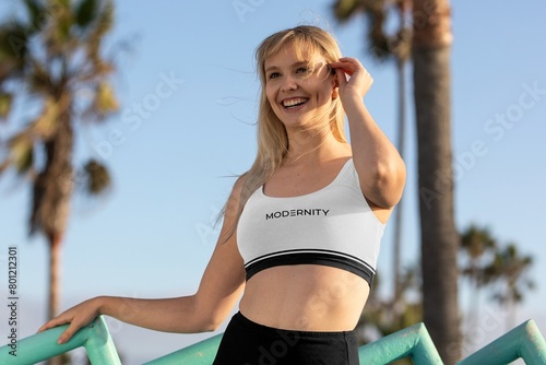Obraz na plátne Woman wearing an athleisure outfit, black and white modernity text design