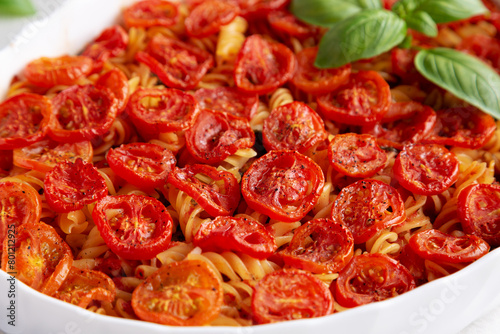Homemade Easy Tomato Basil Pasta Bake, side view. Close-up. © Liudmyla