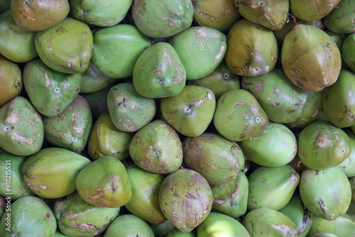 close up of coconuts in a pile