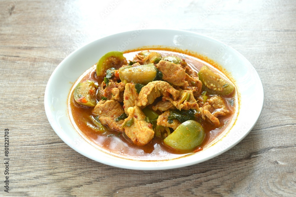 spicy boiled slice pork with eggplant in curry soup on plate spicy boiled slice pork with eggplant in curry soup on plate