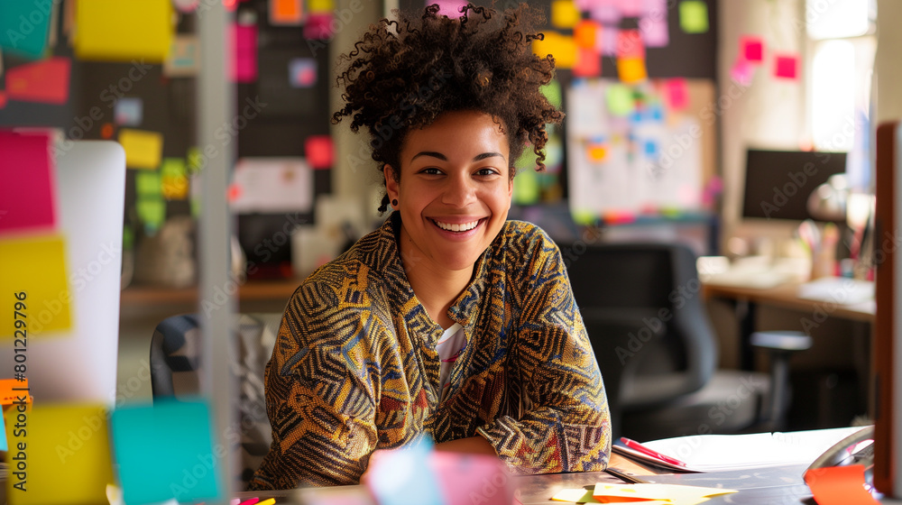 Smiling african american woman at her workplace, working hard in the office at her desk. Pleasant working atmosphere Smiling african american woman at her workplace, working hard in the office at her desk. Pleasant working atmosphere