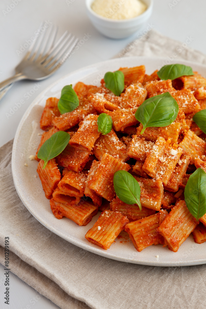 Homemade Vodka Rigatoni Pasta with Parmesan Cheese and Basil, side view. Homemade Vodka Rigatoni Pasta with Parmesan Cheese and Basil, side view.