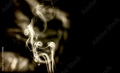 Dramatic smoke trails, art image smoke clouds on dark background.  photo