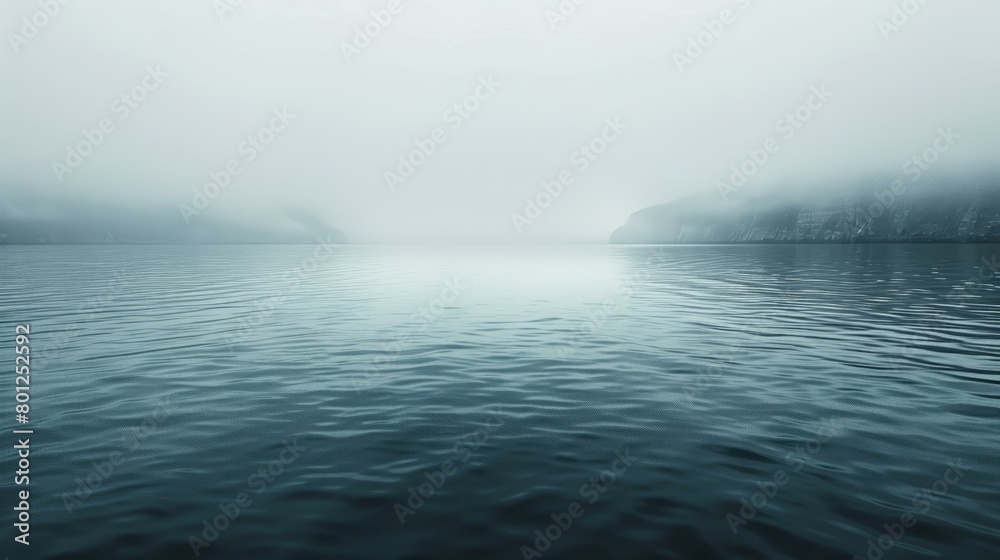 Misty fjord landscape with a mountain in the distance