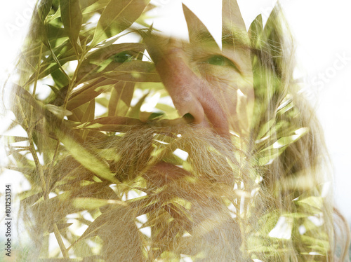 A closeup double exposure portrait of an old man merged with green tree leaves