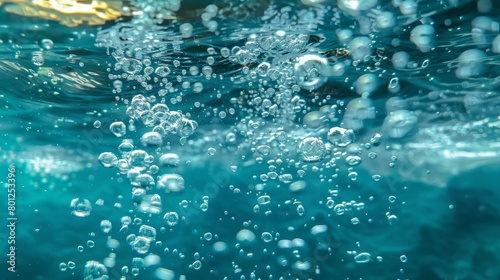 Underwater bubbles in blue ocean water