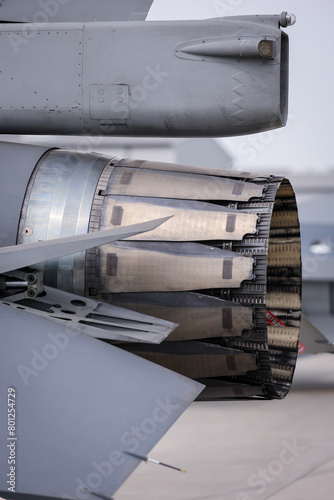 Fighter jet exhaust nozzle detail on a lot of fighter airplanes in parking position.