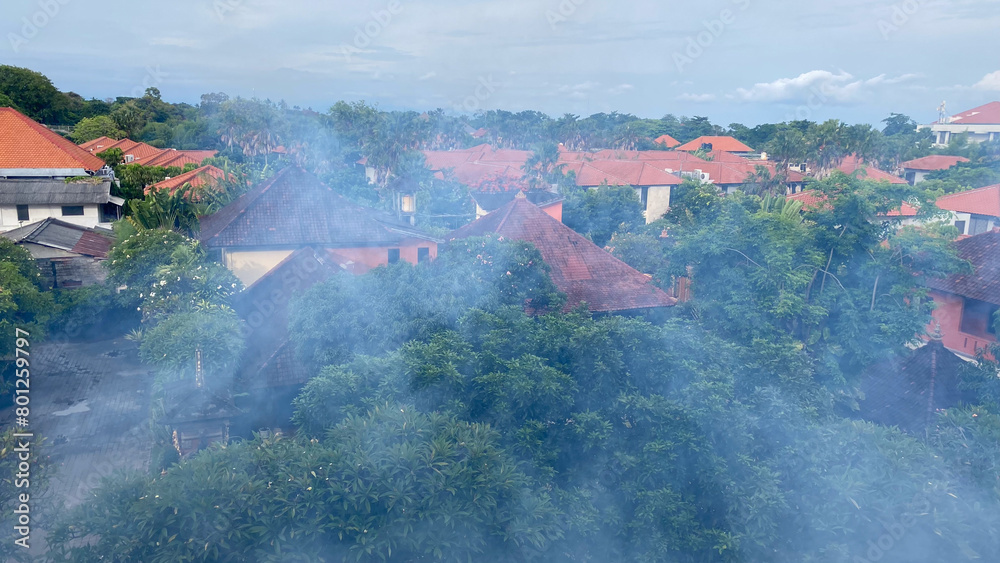 aerial view of village in Bali with haze or morning dew