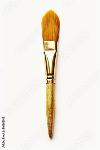 gold paintbrush on white background