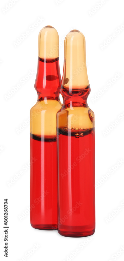 Glass ampoules with liquid isolated on white Glass ampoules with liquid isolated on white