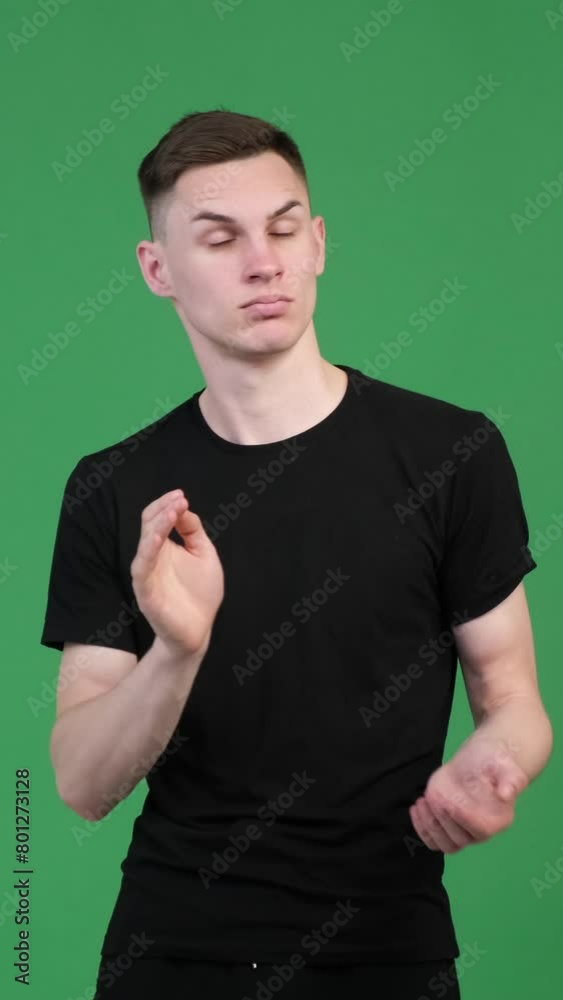 Satisfied and proud Caucasian man clapping hands in approval on green background. Agreement, respect, congratulation. Vertical video. Satisfied and proud Caucasian man clapping hands in approval on green background. Agreement, respect, congratulation. Vertical video.