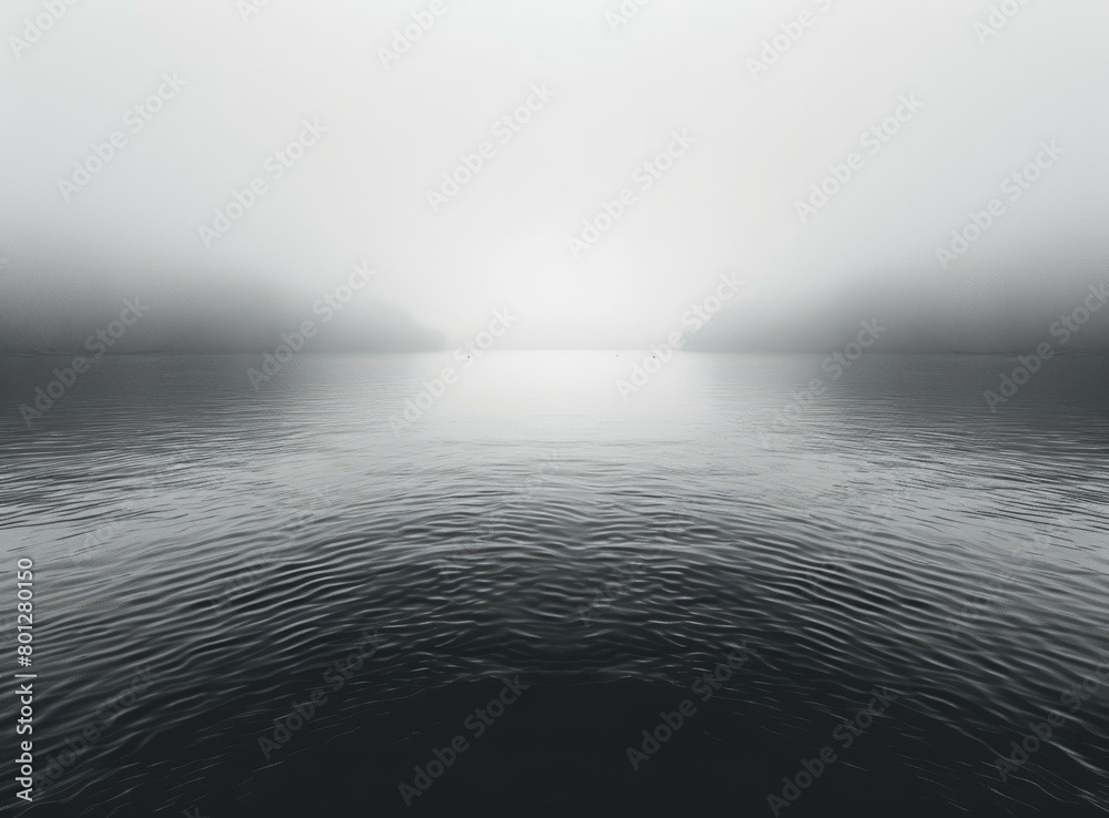 Foggy lake with two boats on the horizon