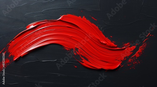 Red acrylic paint on black isolated background