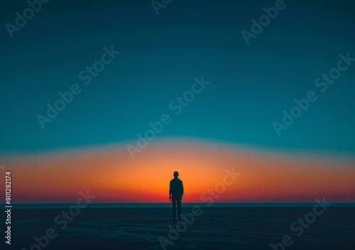 Lonely Man Silhouette at Sunset photo