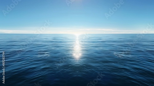 The sun is shining brightly over a vast ocean