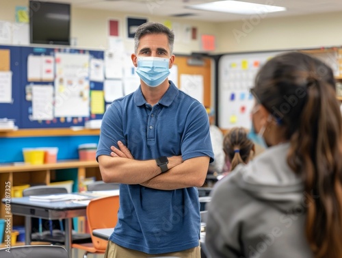 Teacher wearing a mask in a classroom with students