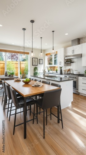 Open concept kitchen with large kitchen island and dining table