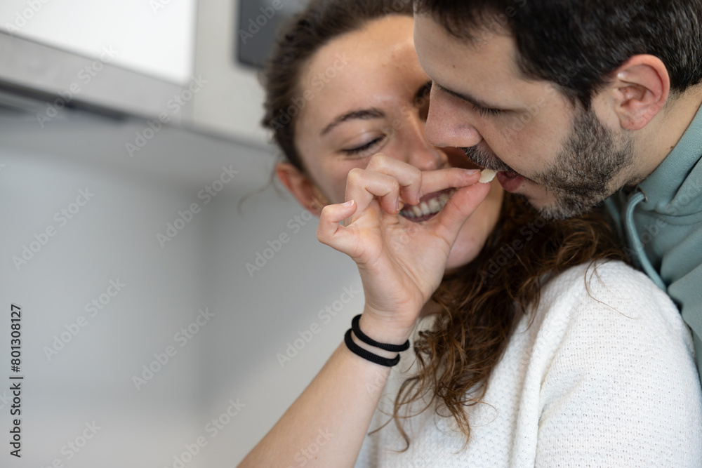couple in love and happy enjoying while cooking together at home couple in love and happy enjoying while cooking together at home