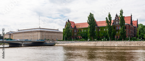 This beautiful late 19th century building houses the National Museum in Wrocław, Poland. Most of the building is covered in green climbing plants.