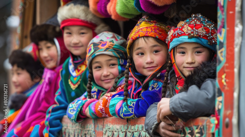 A group of children dressed in vibrant traditional costumes celebrates a local festival