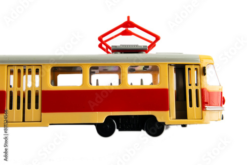 Old Czech red tram isolated on white background. A toy replica of a tram.