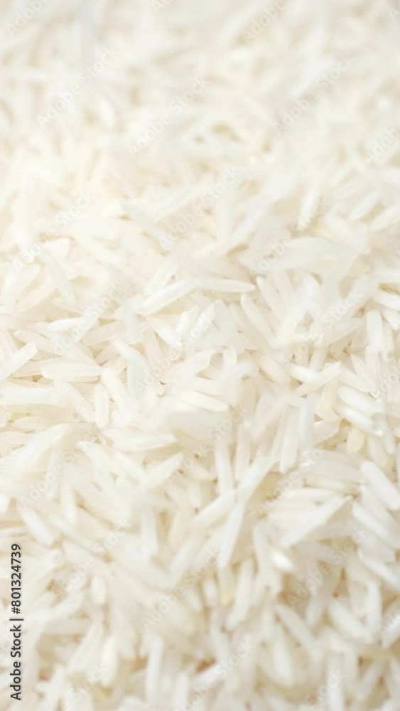 Zoom frame white rice falling on heap, close up Zoom frame white rice falling on heap, close up