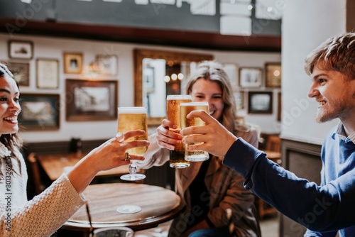 Friends cheering beer glass, celebration photo photo