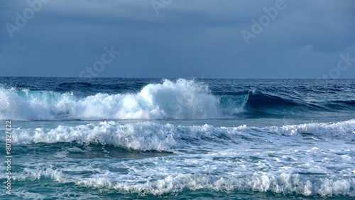 Waves breaking off the beach in Zipolite, Mexico photo