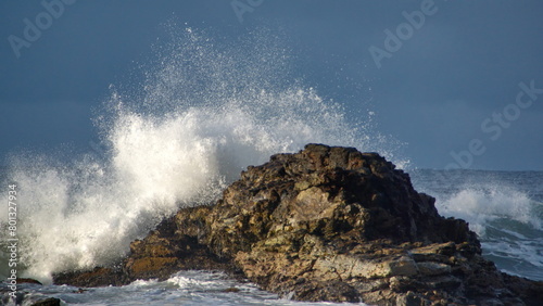Waves breaking over rocks just off the beach in Zipolite, Mexico