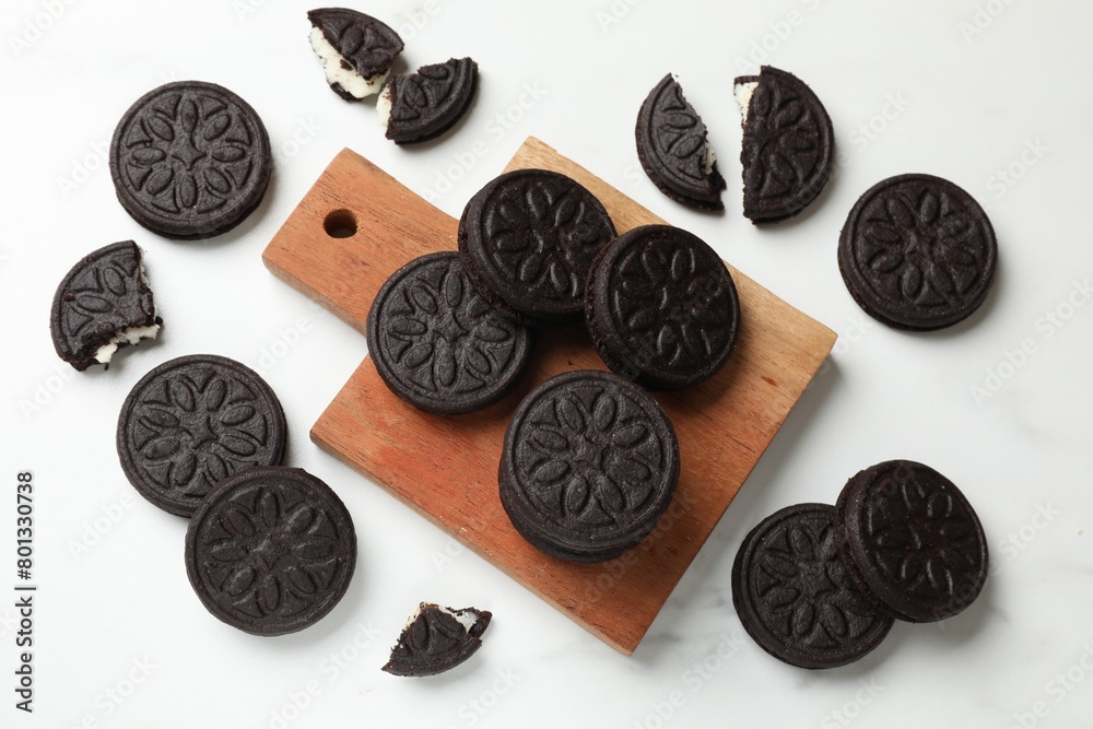 Tasty sandwich cookies on white table, flat lay Tasty sandwich cookies on white table, flat lay