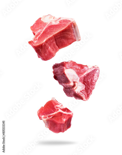 Raw beef meat steaks in the air on a white background © Krafla