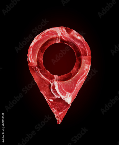 Location symbol made of raw beef meat steaks on a black background © Krafla