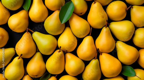 Yellow background with a bunch of ripe pears. Harvesting photo