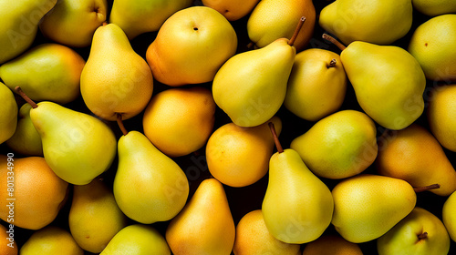 Yellow background with a bunch of ripe pears. Harvesting