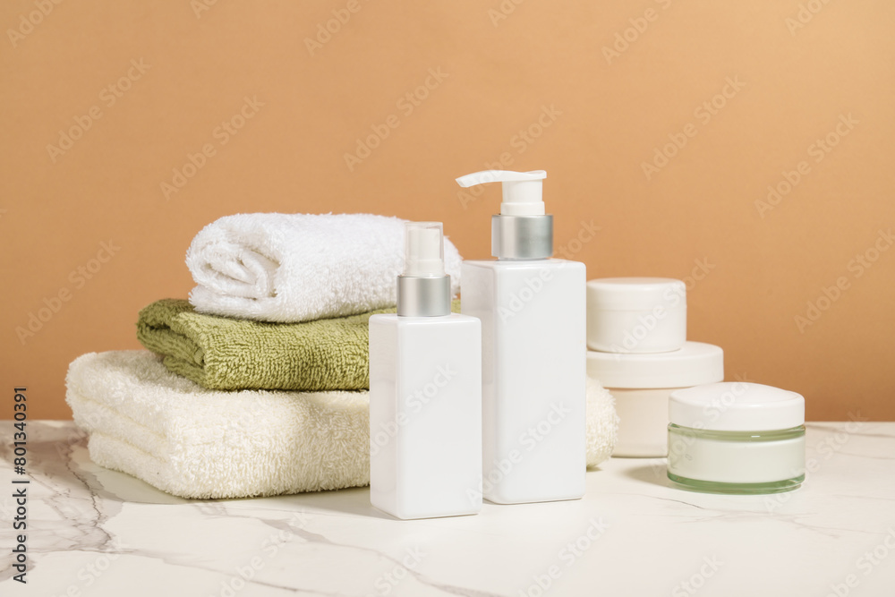 Natural cosmetic and towels in the bathroom. Beauty treatment background.