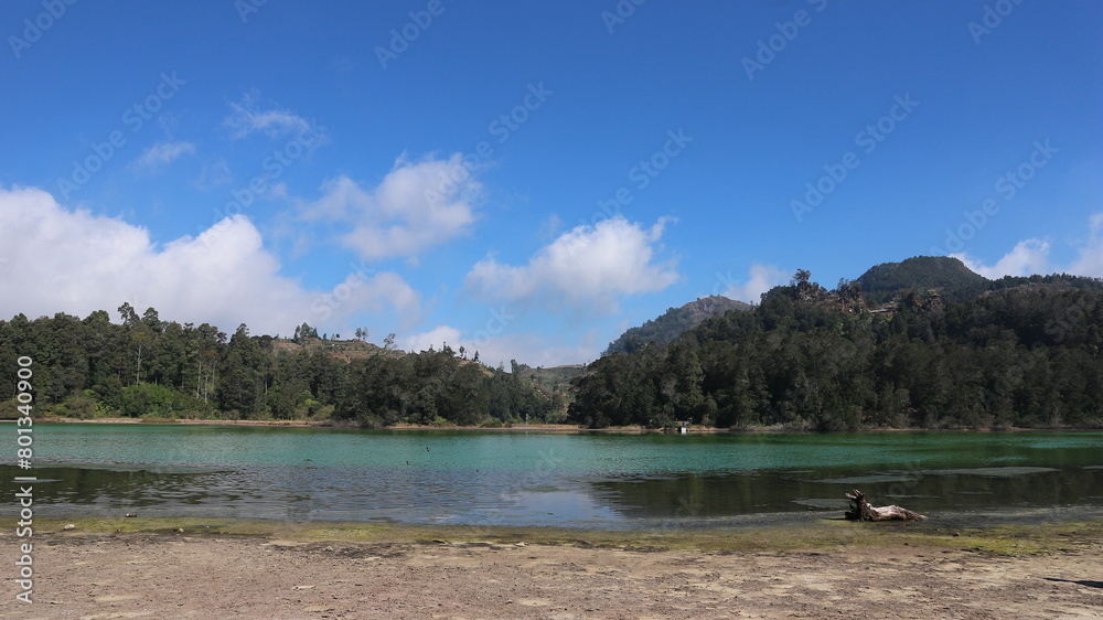 Volcanic lake Telaga Warna at plateau Dieng