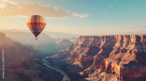 Hot air balloon floating over Grand Canyon with copy space area.