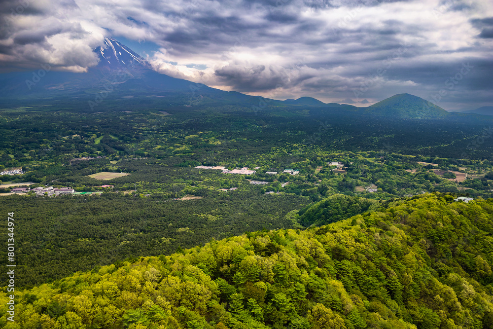 Fototapeta premium Aerial view of a cloud covered Mount Fuji and the 