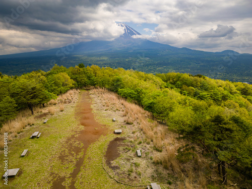 Aerial view of a cloud covered Mount Fuji and the "Sea of Trees" in Yamanashi, Japan