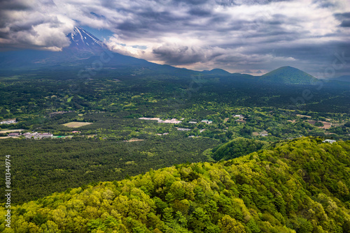 Aerial view of a cloud covered Mount Fuji and the "Sea of Trees" in Yamanashi, Japan © whitcomberd