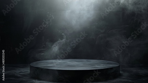 A spotlight shines down on a dark, smoky stage. photo