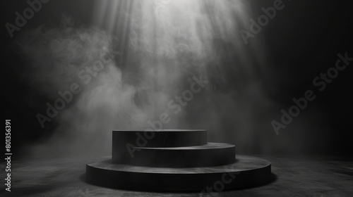 A spotlight shines down on a dark, empty stage. photo